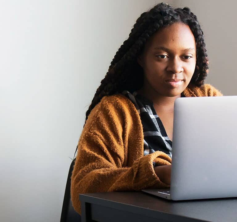 Student working on a laptop.