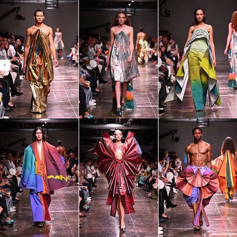 Six models walking down the runway in colorful, avant-garde fashion designs at a fashion show.