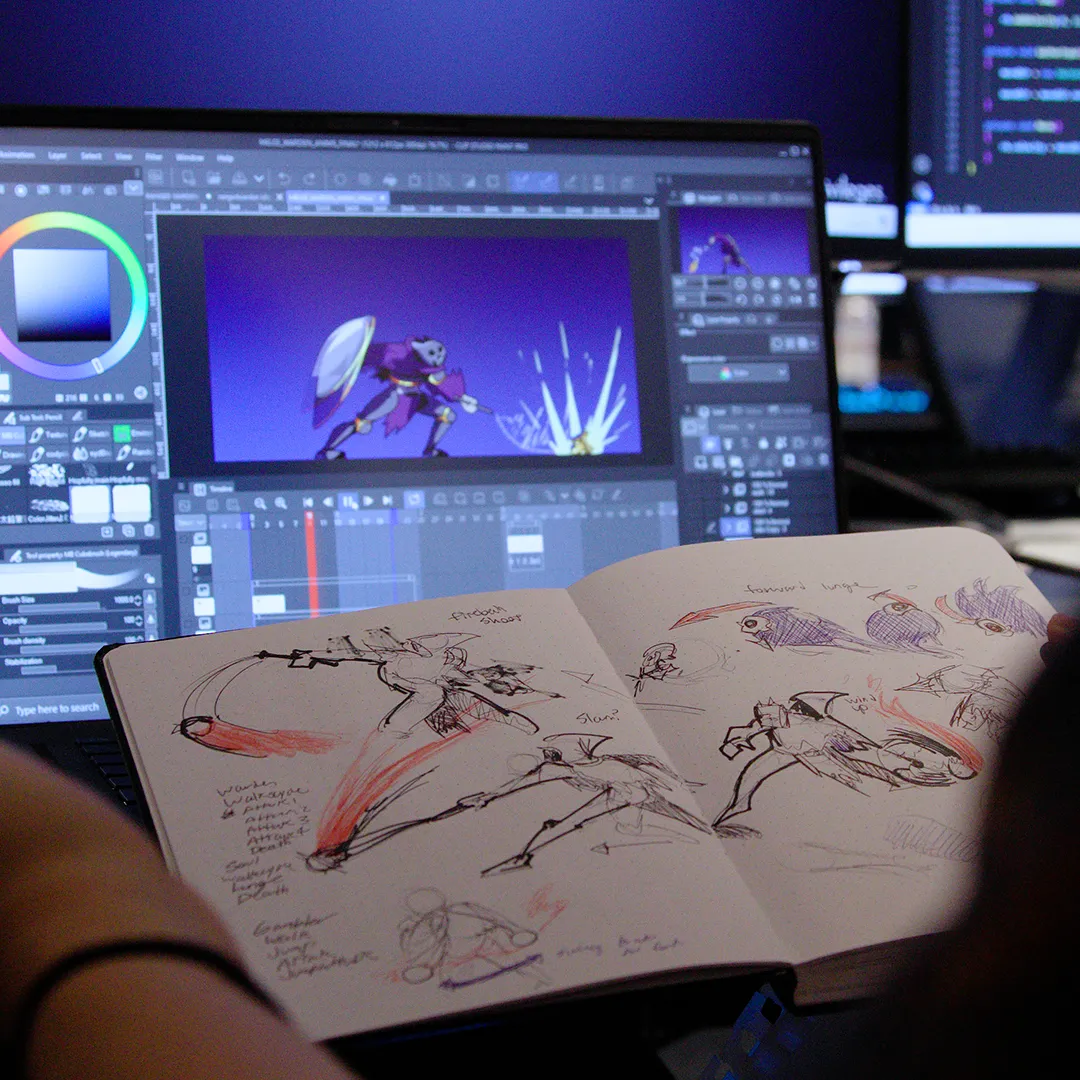 Person working on character animation sketches while using a digital animation software on a computer.