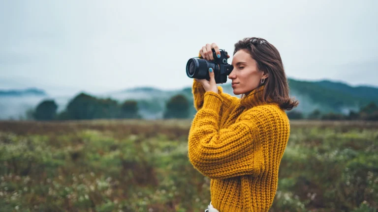Woman taking a photograph outdoors, Block Transfer Guide Academy of Art University