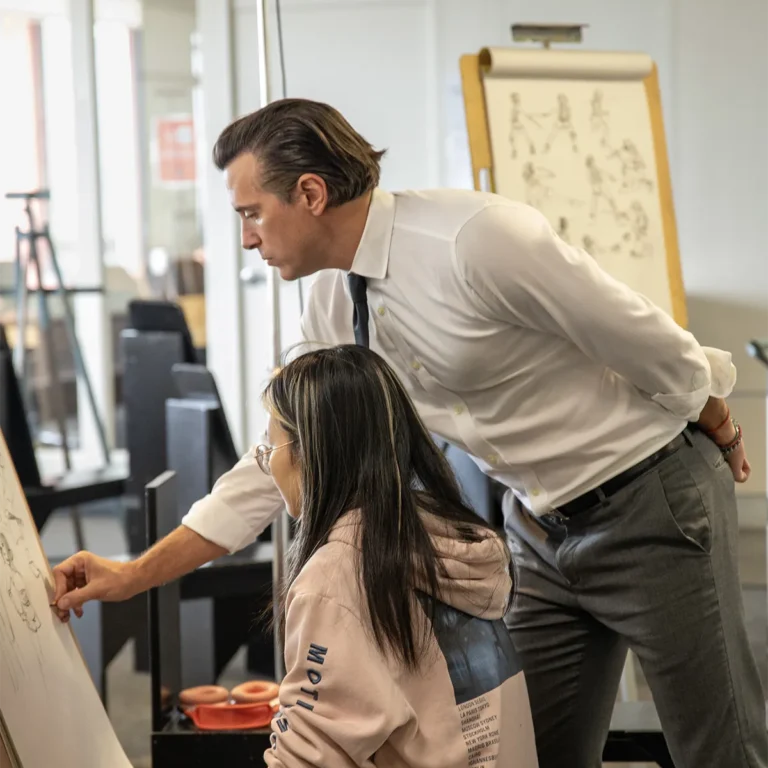 Teacher and Student working on drawing in art class, Student Success Coaching at Academy of Art University