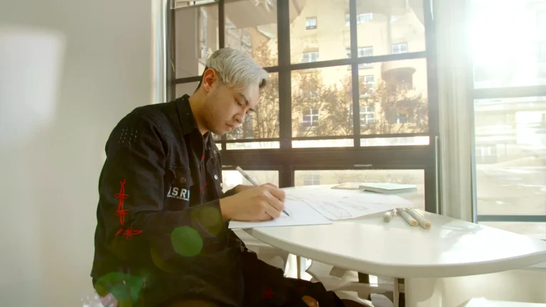 Man Drawing on Paper, International Student English Placement Testing Transfer Students Academy of Art University