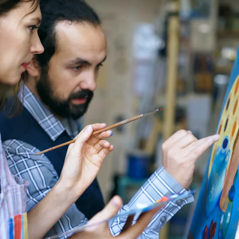 A teacher and student working on painting, Meeting Undergraduate Liberal Arts Requirements at Academy of Art University