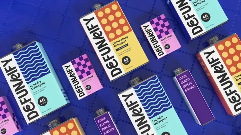 Colorful detergent boxes arranged diagonally on a blue tiled surface.