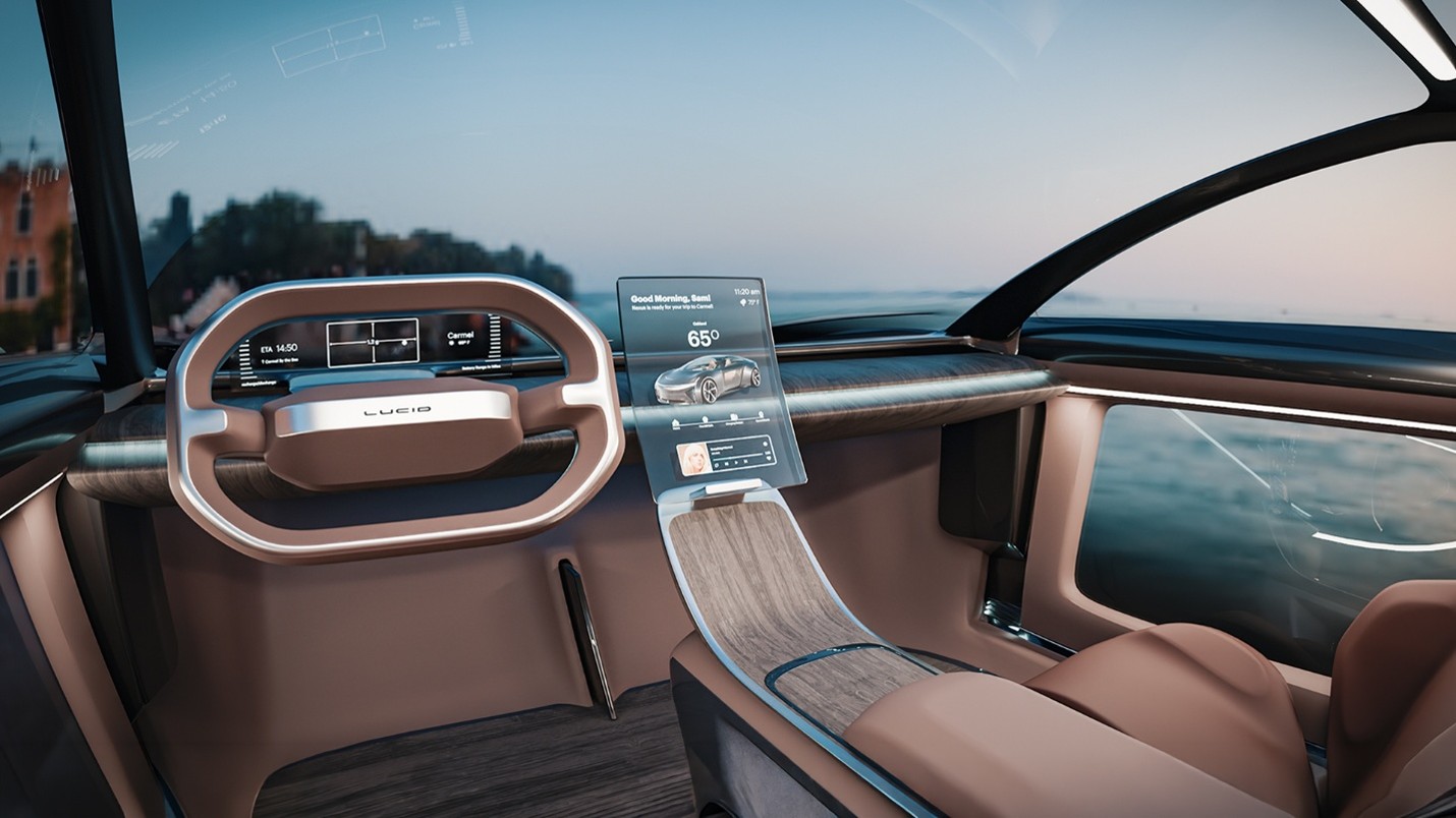 Futuristic car cockpit with curved steering wheel and central touchscreen display showing car and weather info