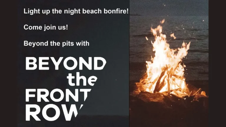 A blazing bonfire illuminates a beach at night, with text reading: 