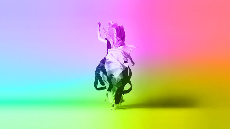 A person wearing a flowing, abstract garment dances amidst a vibrant, multicolored gradient background, blending hues of pink, green, blue, and yellow.