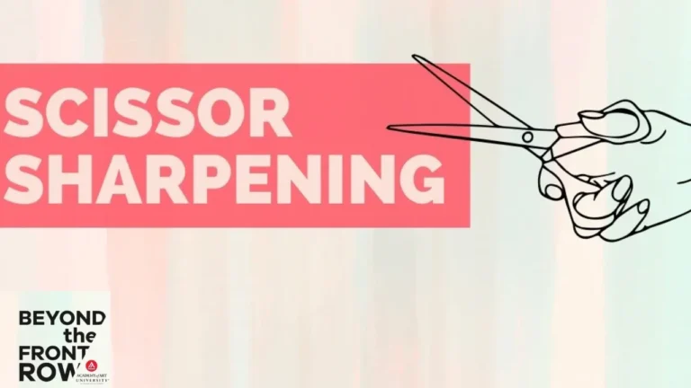 A hand holds scissors in front of a red rectangle with the text 