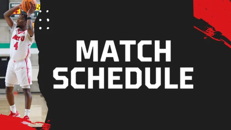 A basketball player holds the ball with both hands, wearing a white and red uniform with 