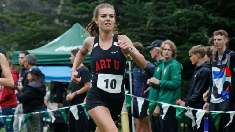 Runner strides forward, wearing a black singlet with 