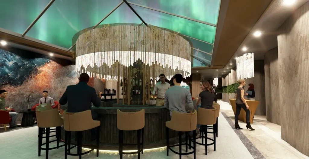 A round bar beneath a decorative chandelier hosts patrons seated on stools, engaging in conversation. The environment features modern decor, ambient lighting, and a vibrant wall mural.